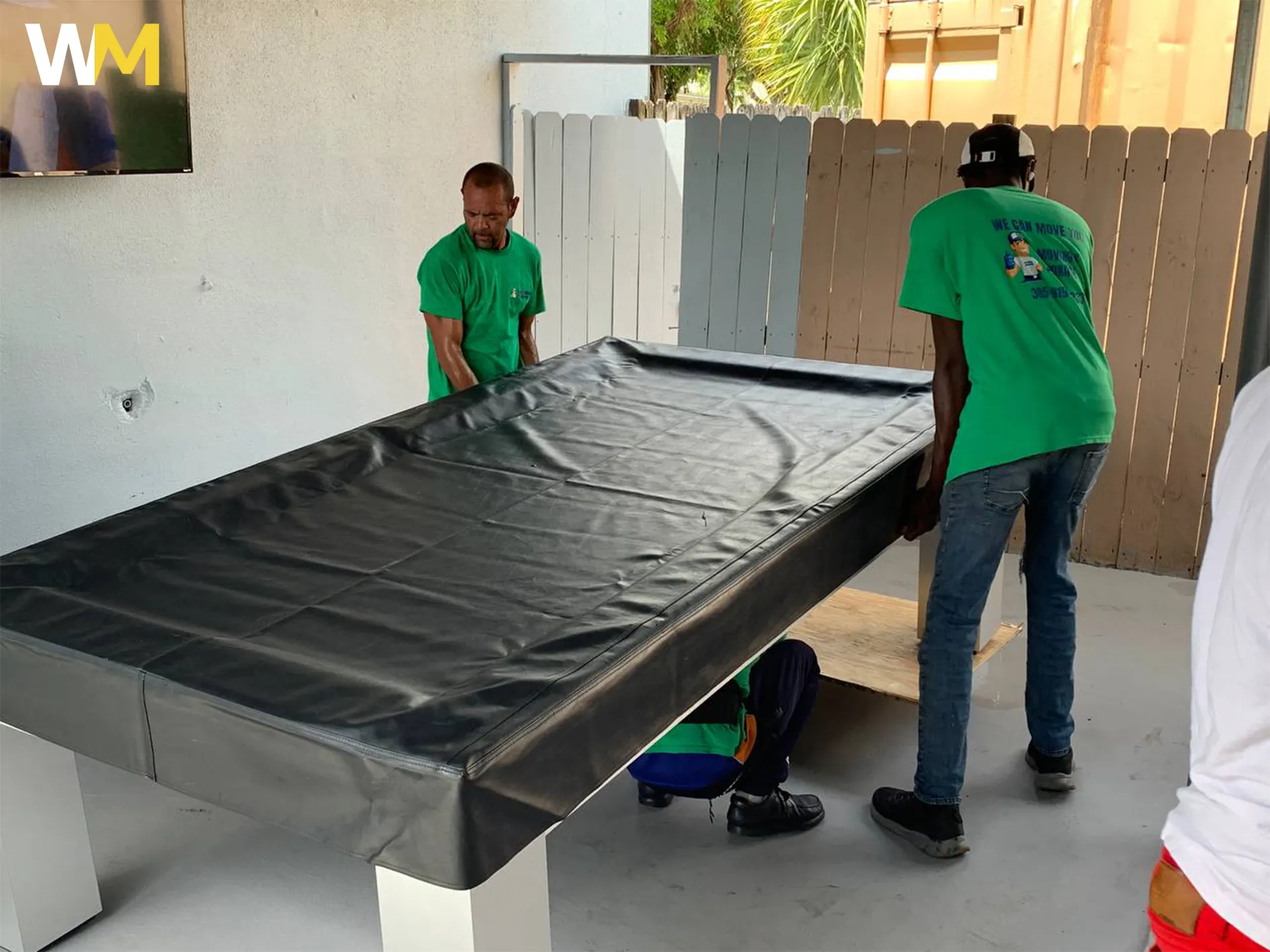 Team Members Packing Customer Pool Table