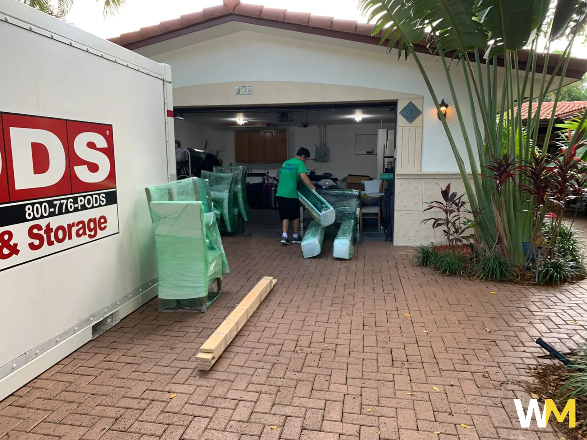 Team Member Loading Packed Boxes and Furniture